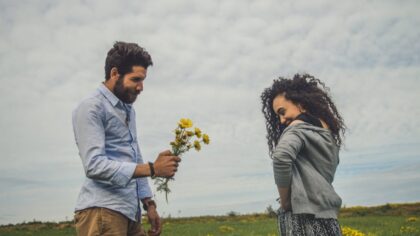Husband giving flowers to his wife